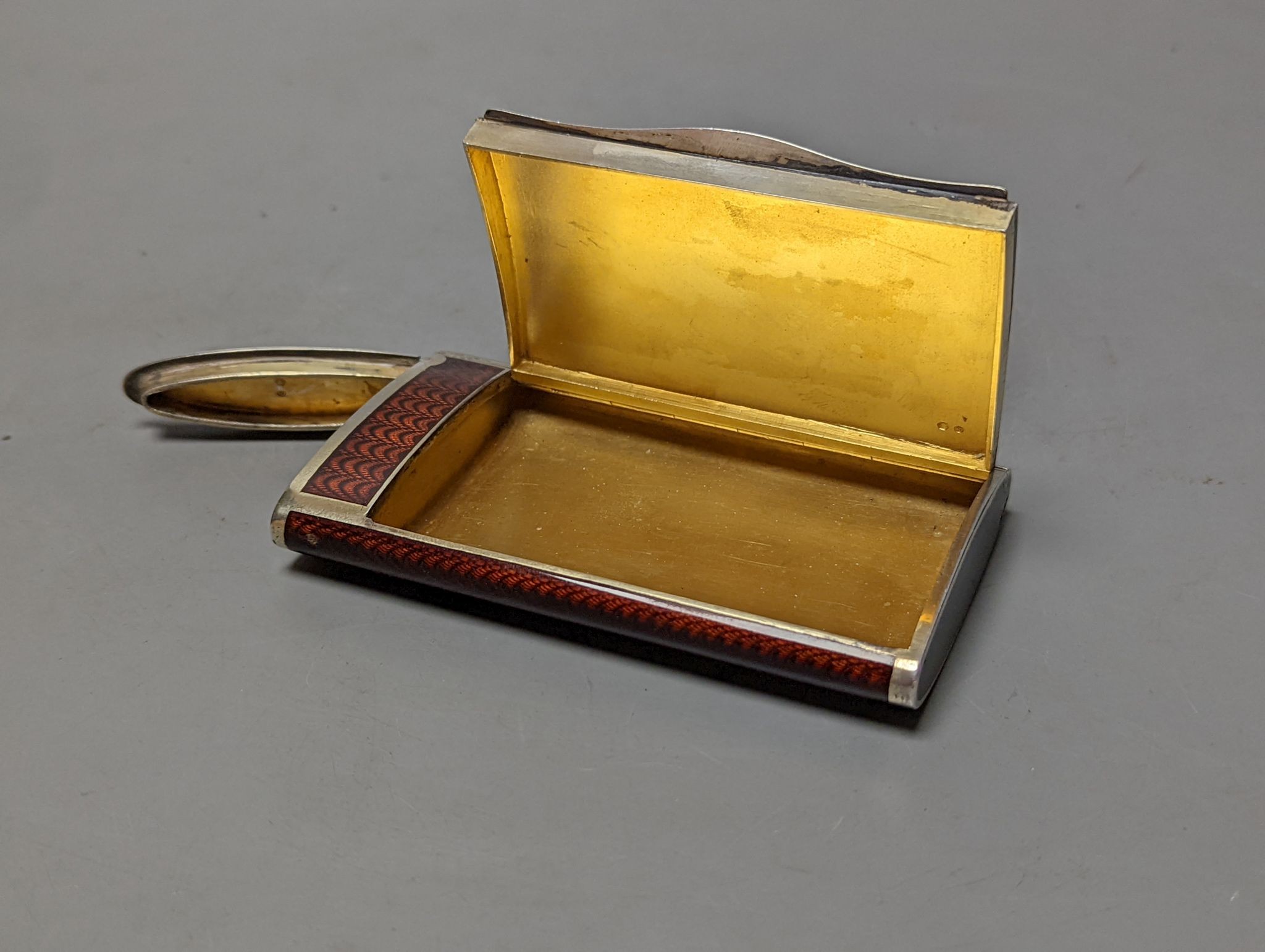 A 20th century Austro-Hungarian white metal and brown guilloche enamelled cigarette case, with match compartment?, 98mm (a.f.).